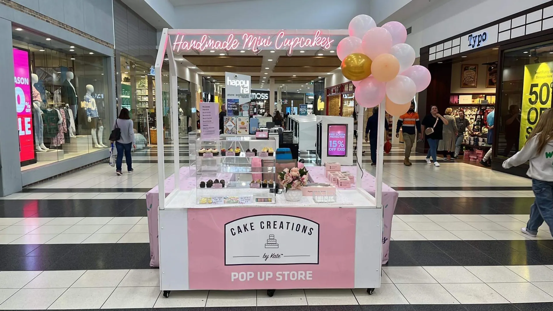 Handmade Mini Cupcakes pop-up store with pink and white kiosk in shopping centre